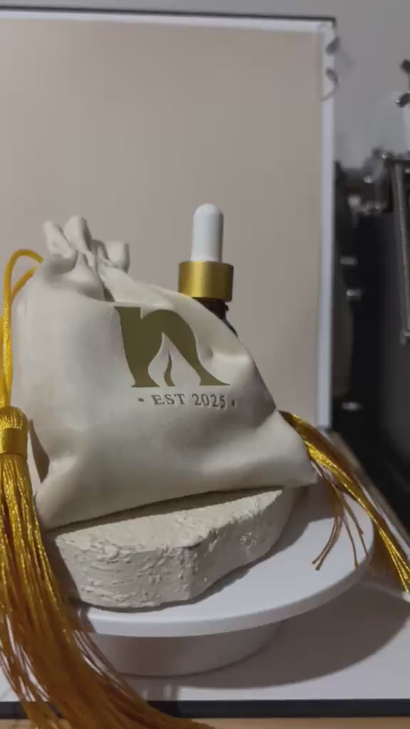 Wedding favor oil in a velvet pouch