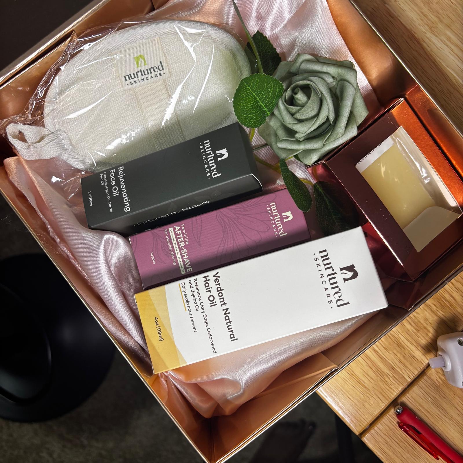 Nurtured Skincare corporate gift box with oils and a botanical rose